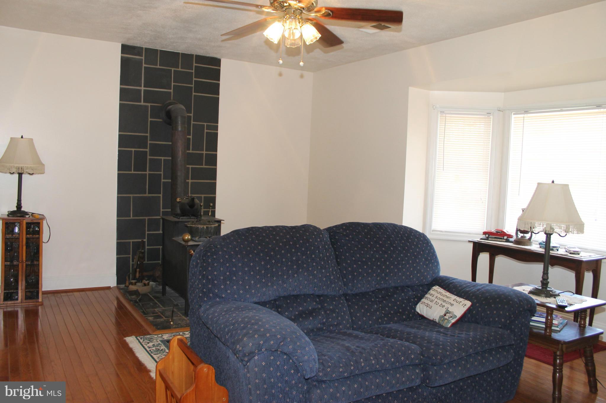 10275 Dutch Hollow Road Rixeyville, VA 22737 - Photo 4 of 21 a living room with furniture and a flat screen tv