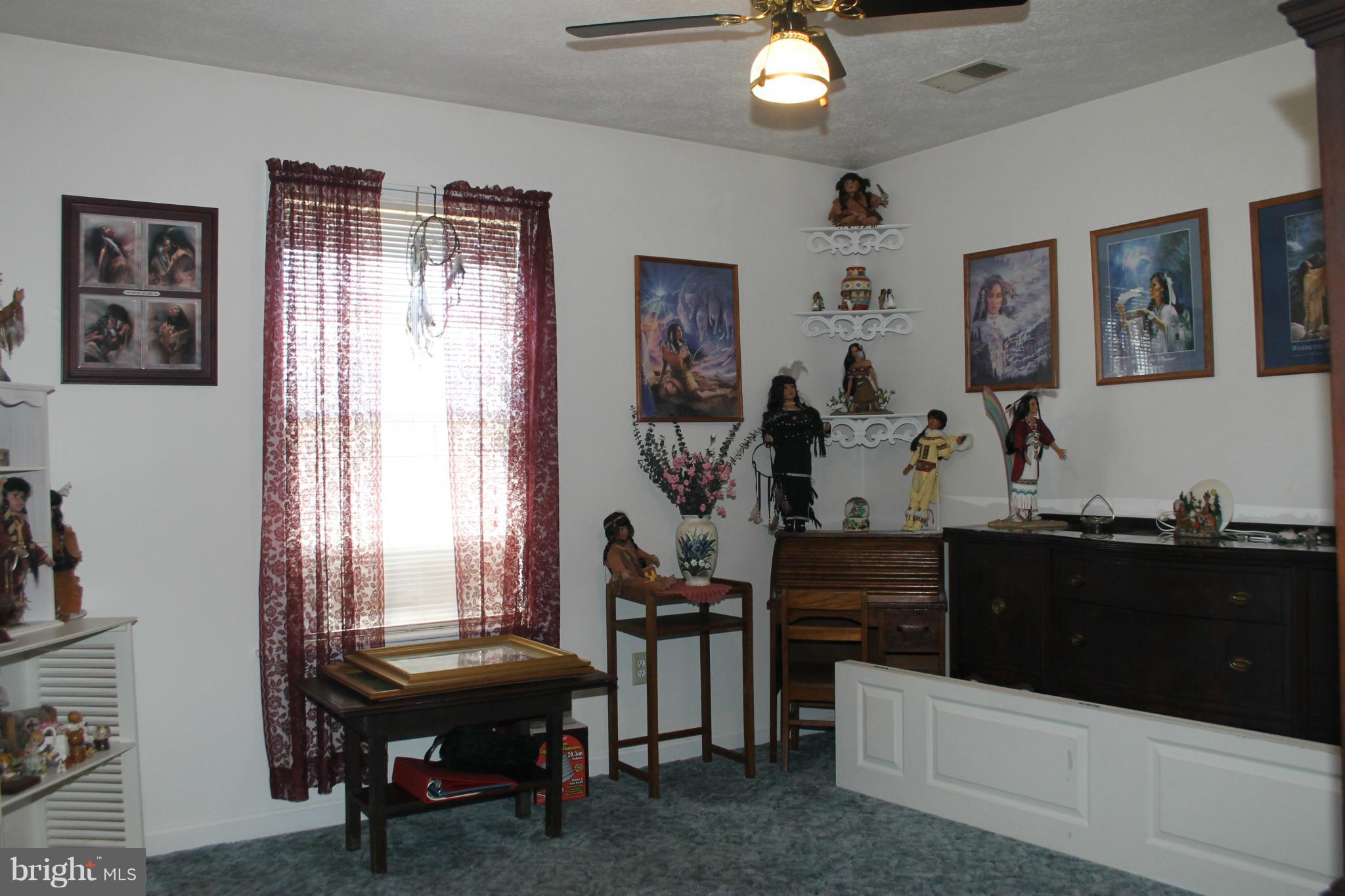 10275 Dutch Hollow Road Rixeyville, VA 22737 - Photo 9 of 21 a view of a workspace with furniture and a window