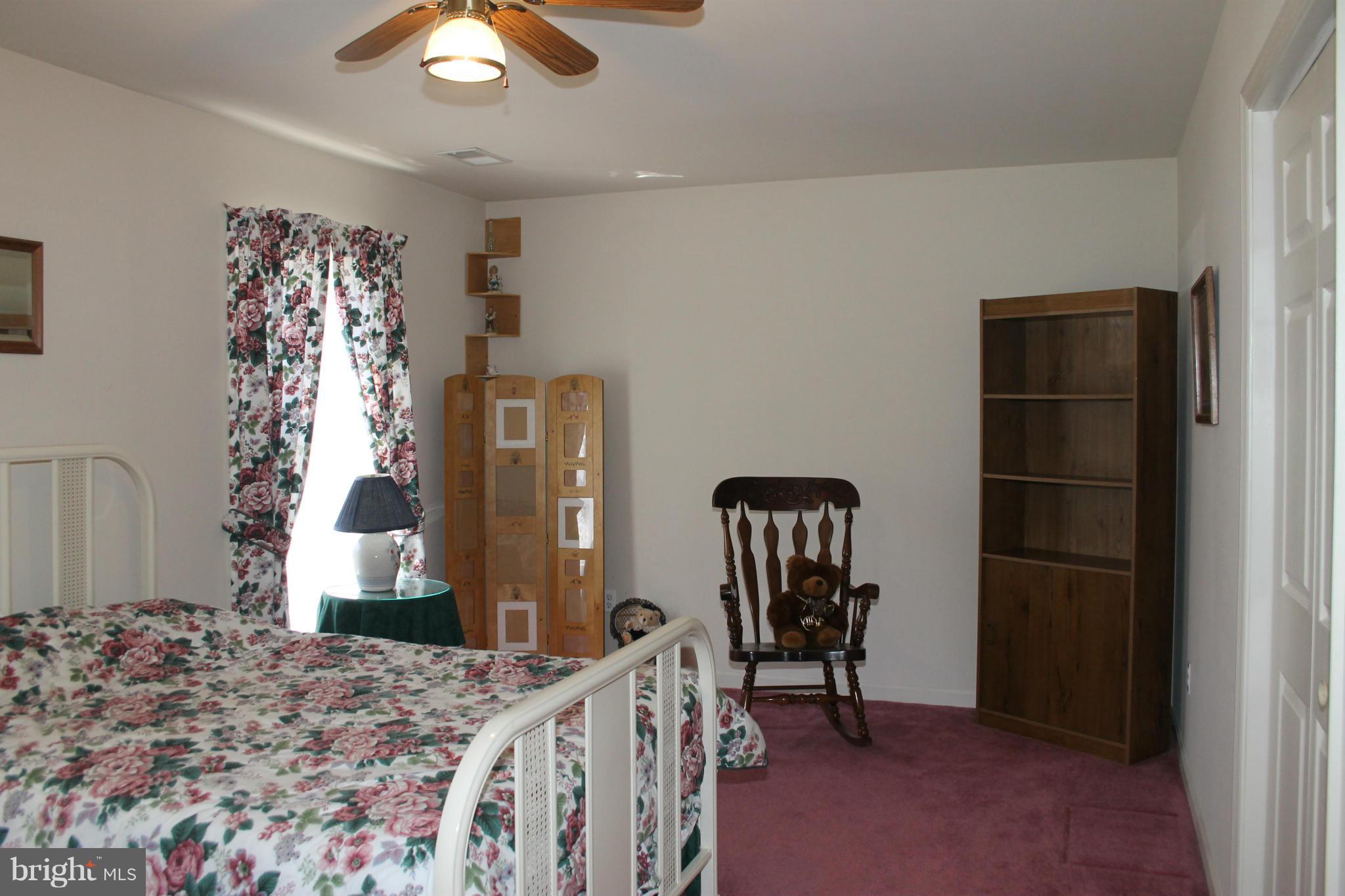 10275 Dutch Hollow Road Rixeyville, VA 22737 - Photo 10 of 21 a bedroom with a bed and a window