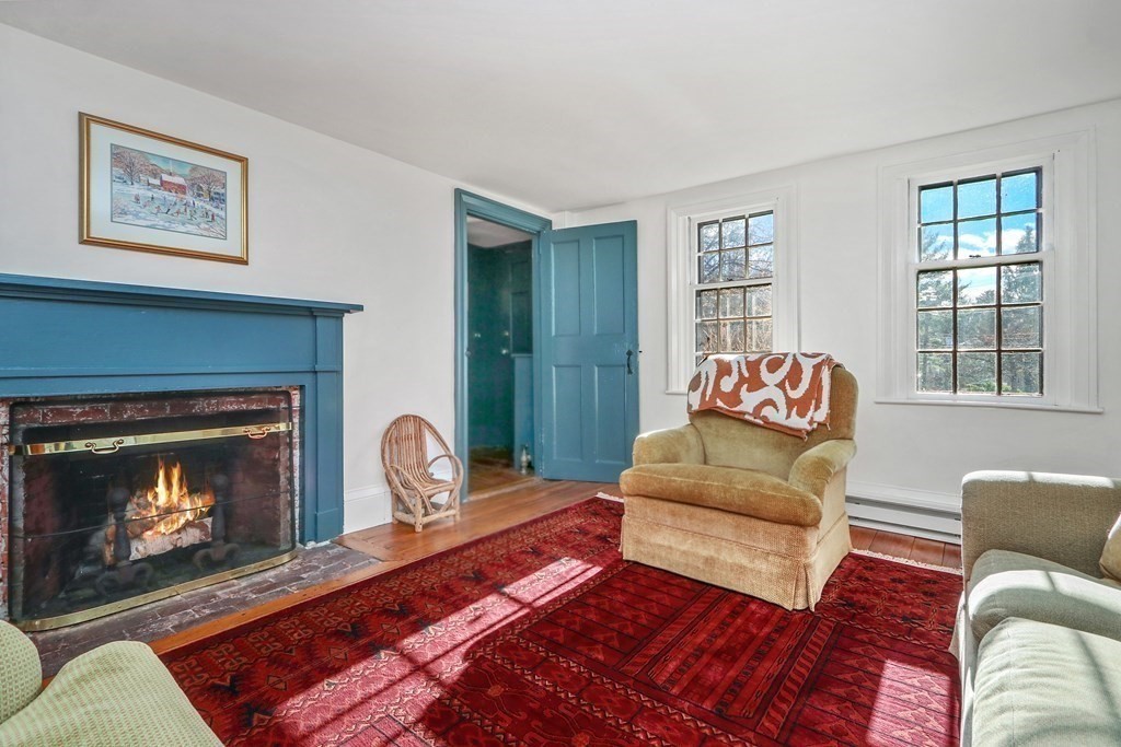 150 Concord Road Sudbury, MA 01776 - Photo 14 of 34 a living room with furniture and a fireplace
