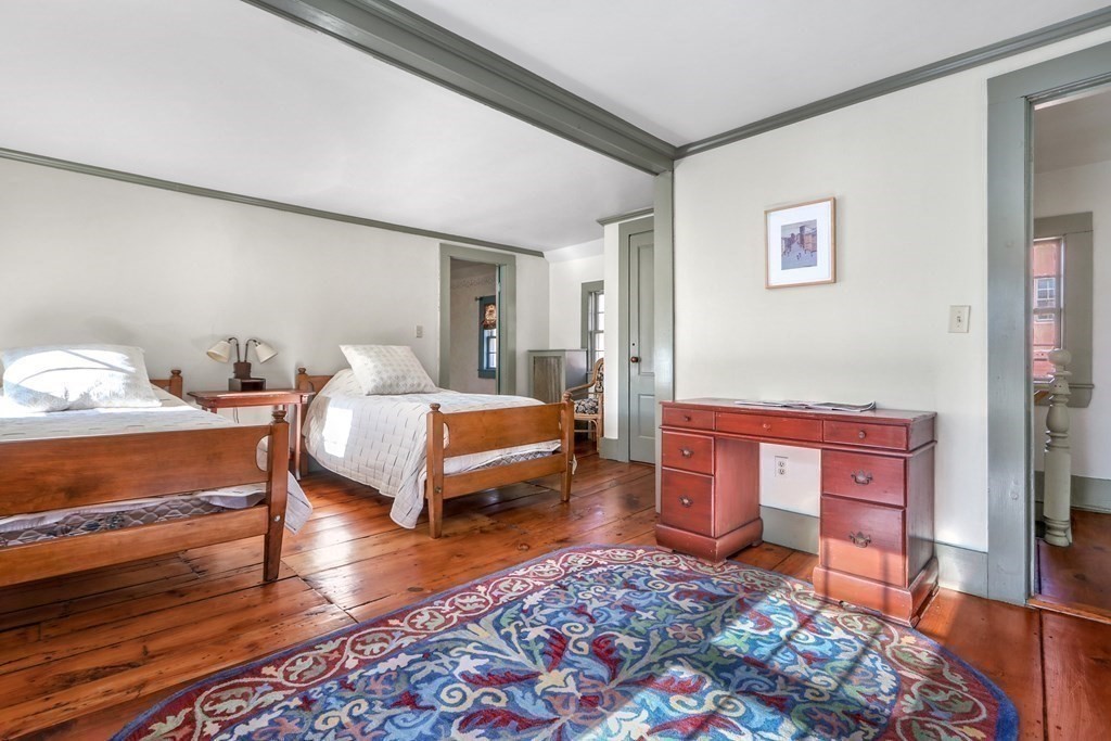 150 Concord Road Sudbury, MA 01776 - Photo 18 of 34 a bedroom with furniture and wooden floor