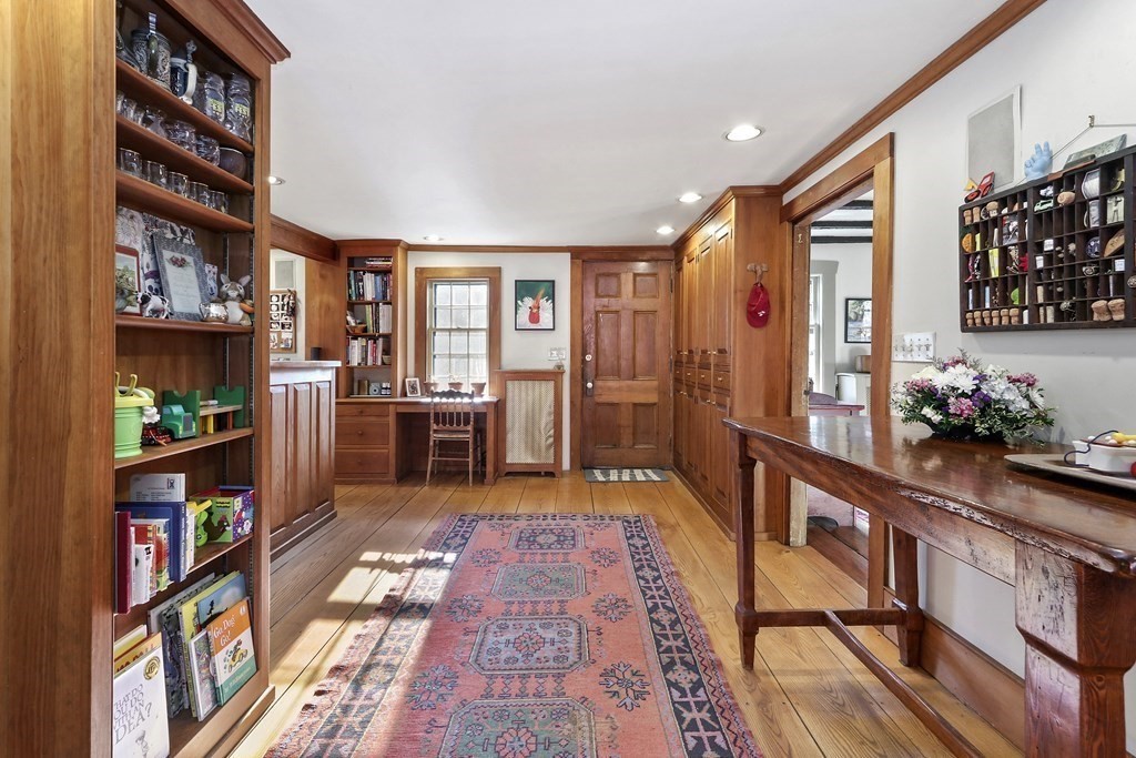 150 Concord Road Sudbury, MA 01776 - Photo 4 of 34 a room with lots of books and furniture