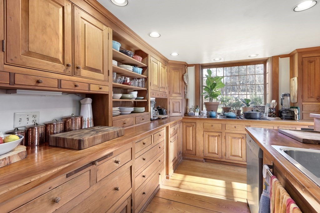150 Concord Road Sudbury, MA 01776 - Photo 6 of 34 a large kitchen with stainless steel appliances granite countertop a large window and a counter space