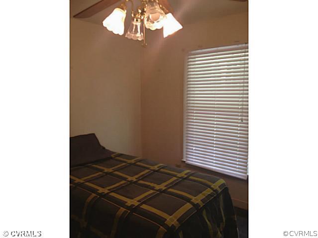 15504 Nash Road Dewitt, VA 23840 - Photo 15 of 18 a room with a chandelier and a rug
