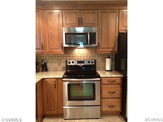 15504 Nash Road Dewitt, VA 23840 - Photo 7 of 18 a stove top oven sitting inside of a kitchen