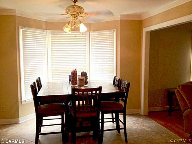 15504 Nash Road Dewitt, VA 23840 - Photo 8 of 18 a view of a dining room with furniture and wooden floor