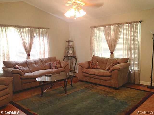 15504 Nash Road Dewitt, VA 23840 - Photo 9 of 18 a living room with furniture and a large window