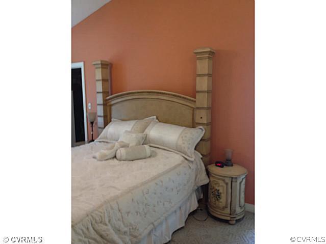 15504 Nash Road Dewitt, VA 23840 - Photo 10 of 18 a bedroom with a bed and a night stand