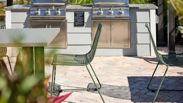 a view of a kitchen with a sink and cabinets