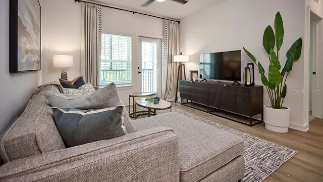 a living room with furniture and a flat screen tv