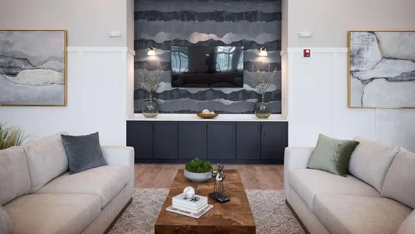 a living room with furniture and lamp