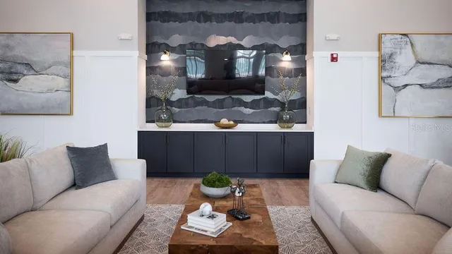 a living room with furniture and lamp