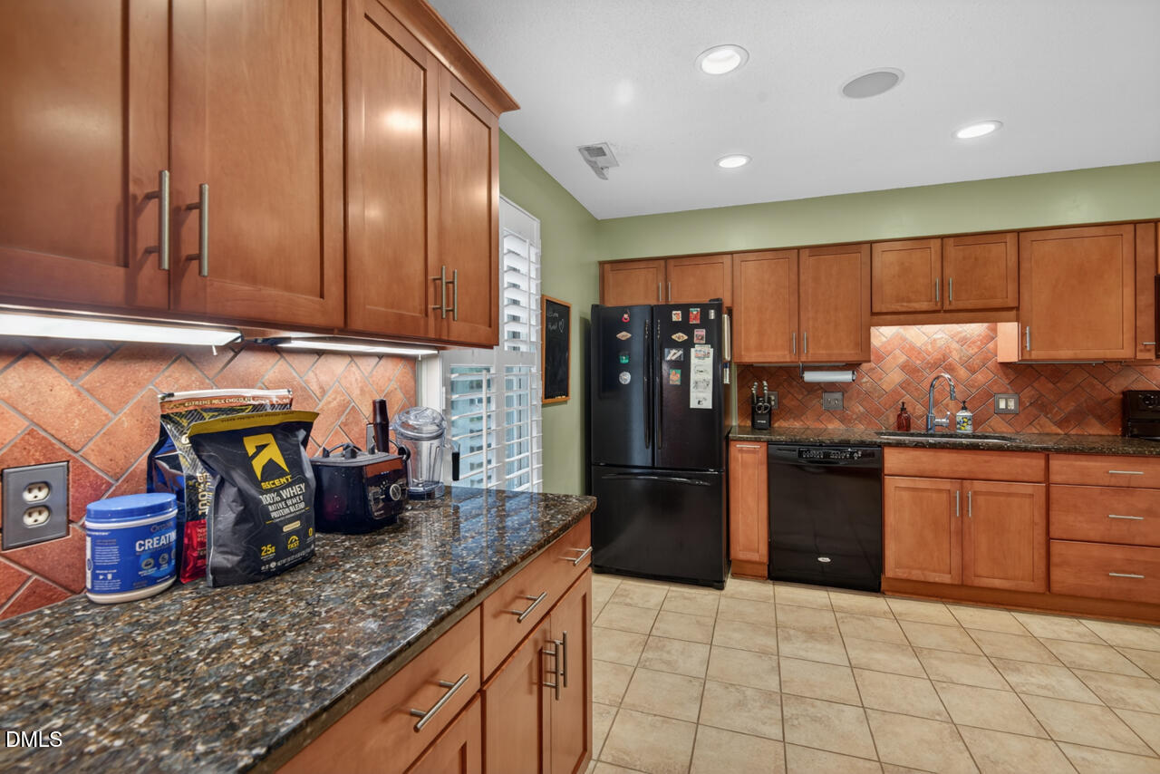 3307 Coachman's Way Durham, NC 27705 - Photo 5 of 50 a kitchen with refrigerator and cabinets
