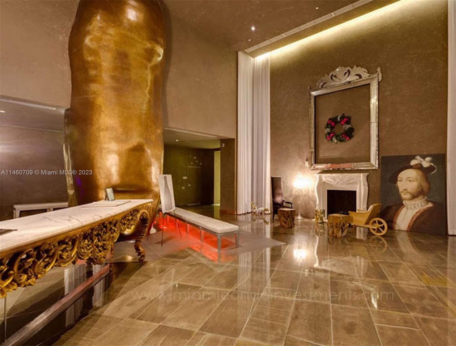 Brickell Miami, FL 33131 - Photo 16 of 27 a living room with furniture a fireplace and potted plant