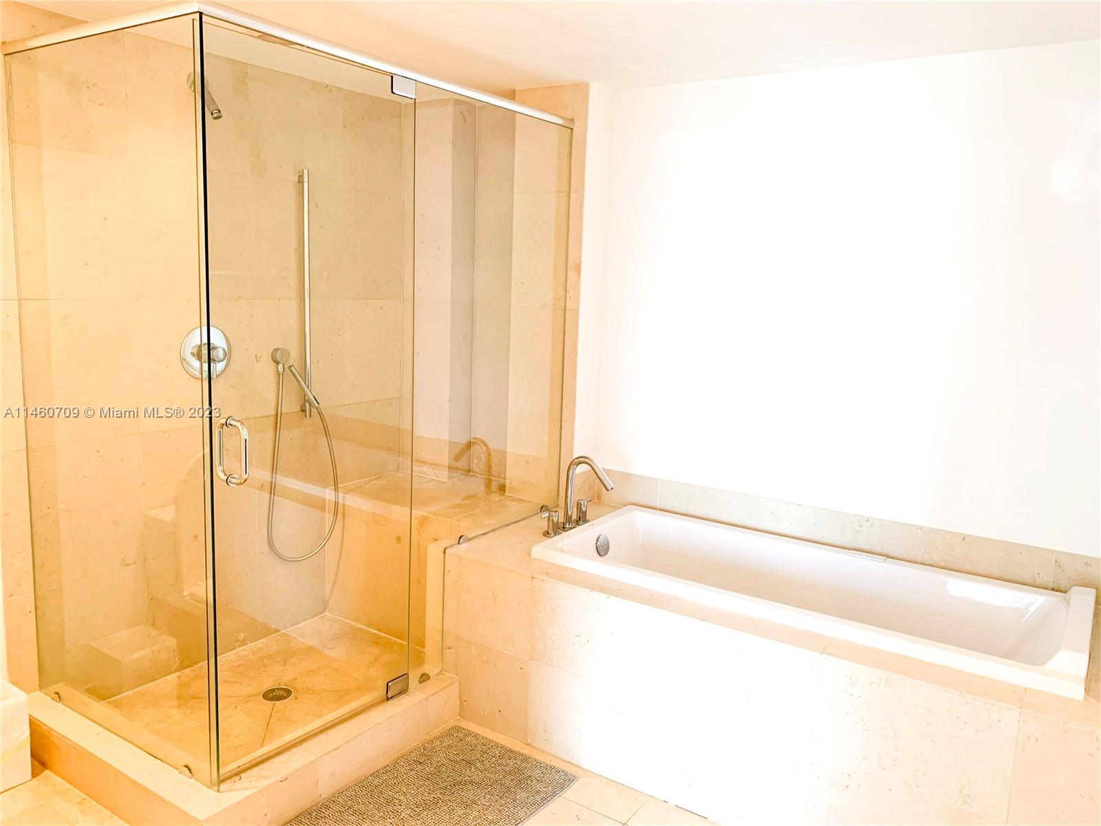 Brickell Miami, FL 33131 - Photo 2 of 27 a bathroom with a tub and shower