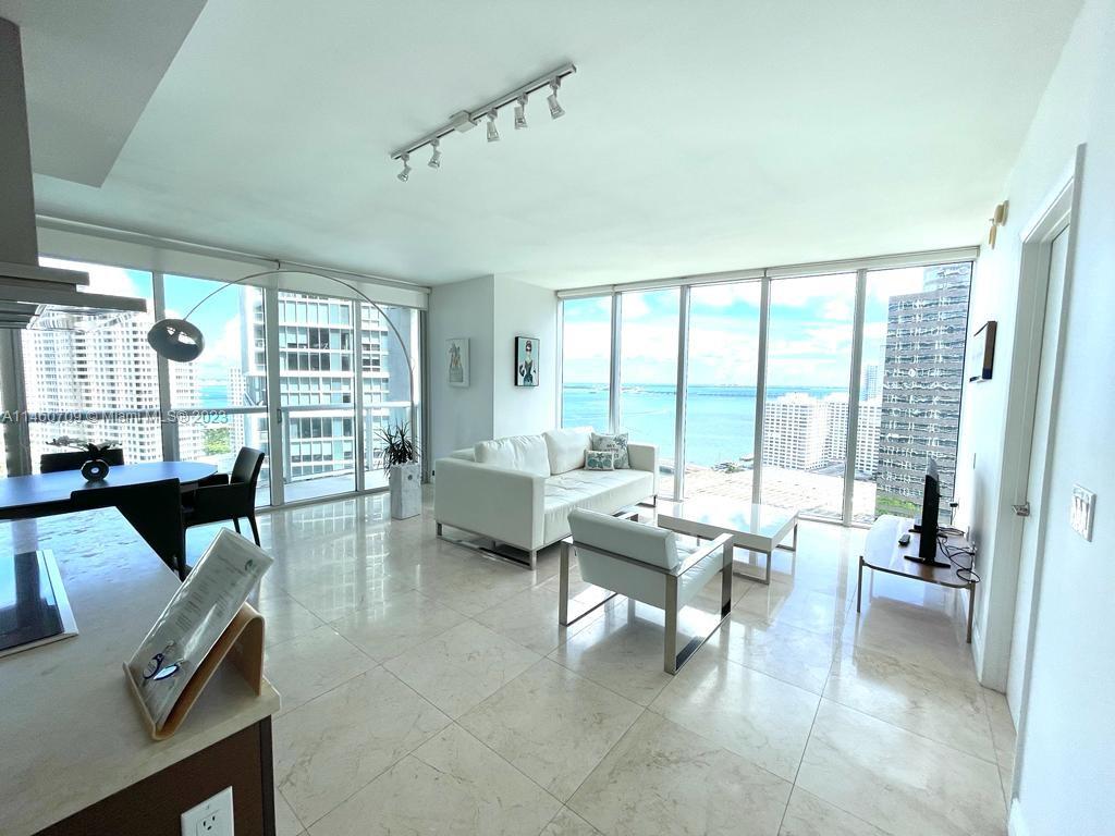 Brickell Miami, FL 33131 - Photo 26 of 27 a living room with furniture and large windows