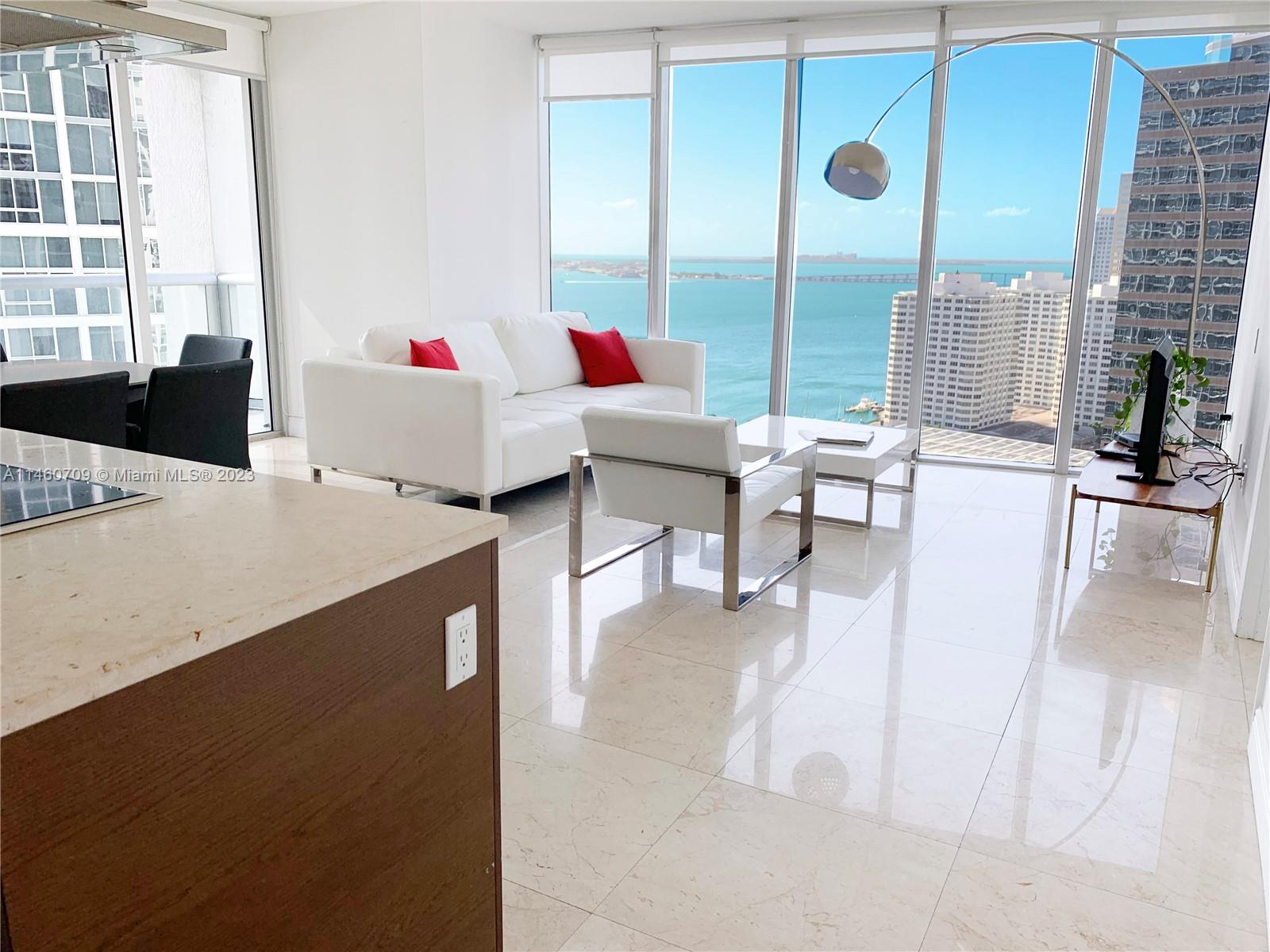 Brickell Miami, FL 33131 - Photo 4 of 27 a living room with furniture and a floor to ceiling window