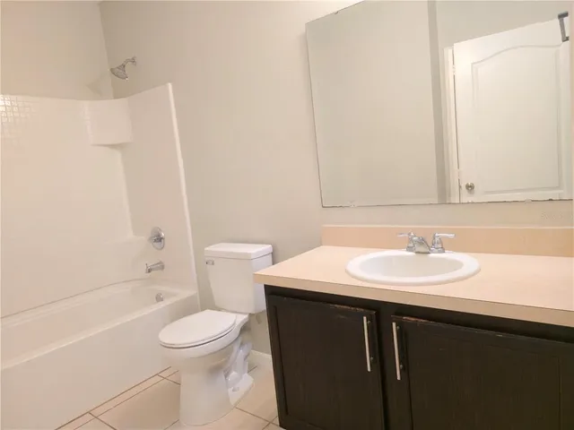a view of a bathroom from the hallway