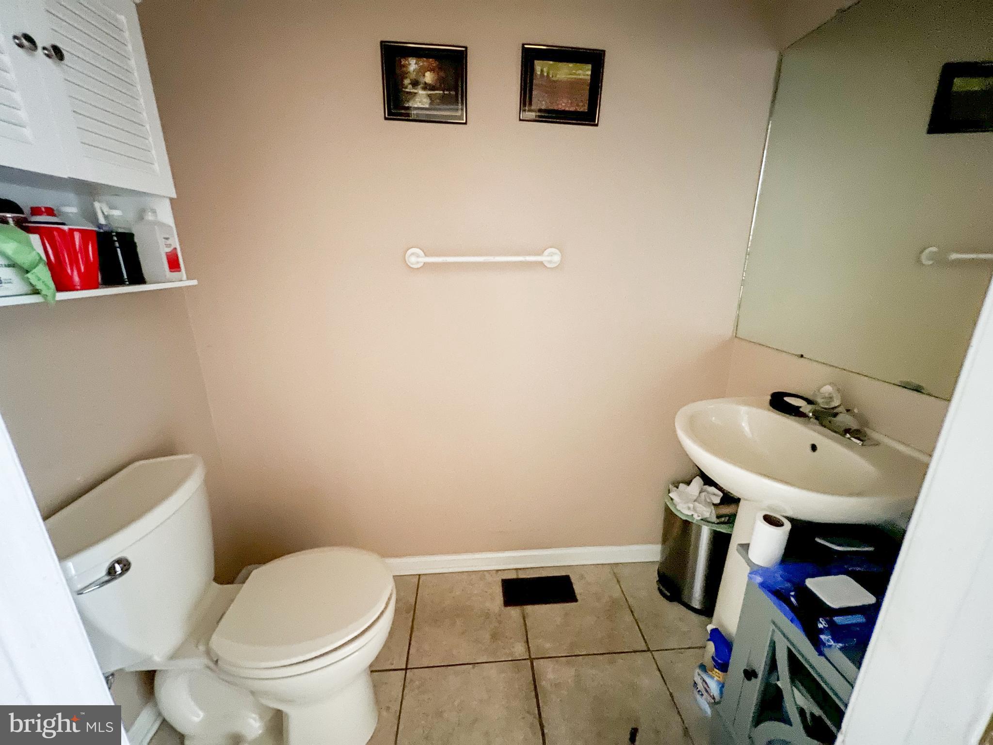 214 Mt Vernon Drive Bear, DE 19701 - Photo 12 of 44 a bathroom with a sink toilet and a mirror