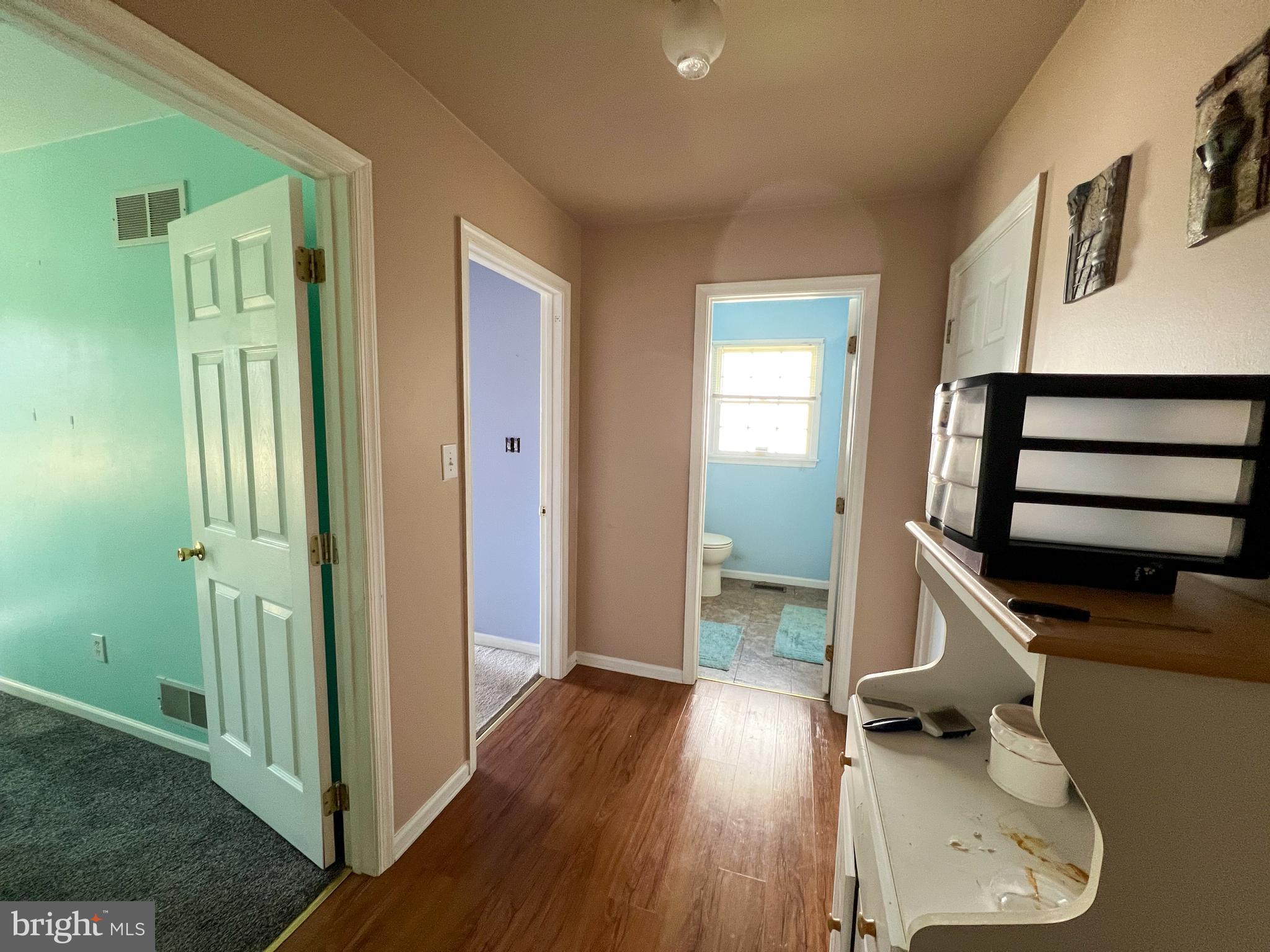 214 Mt Vernon Drive Bear, DE 19701 - Photo 19 of 44 a view of a hallway with wooden floor and staircase