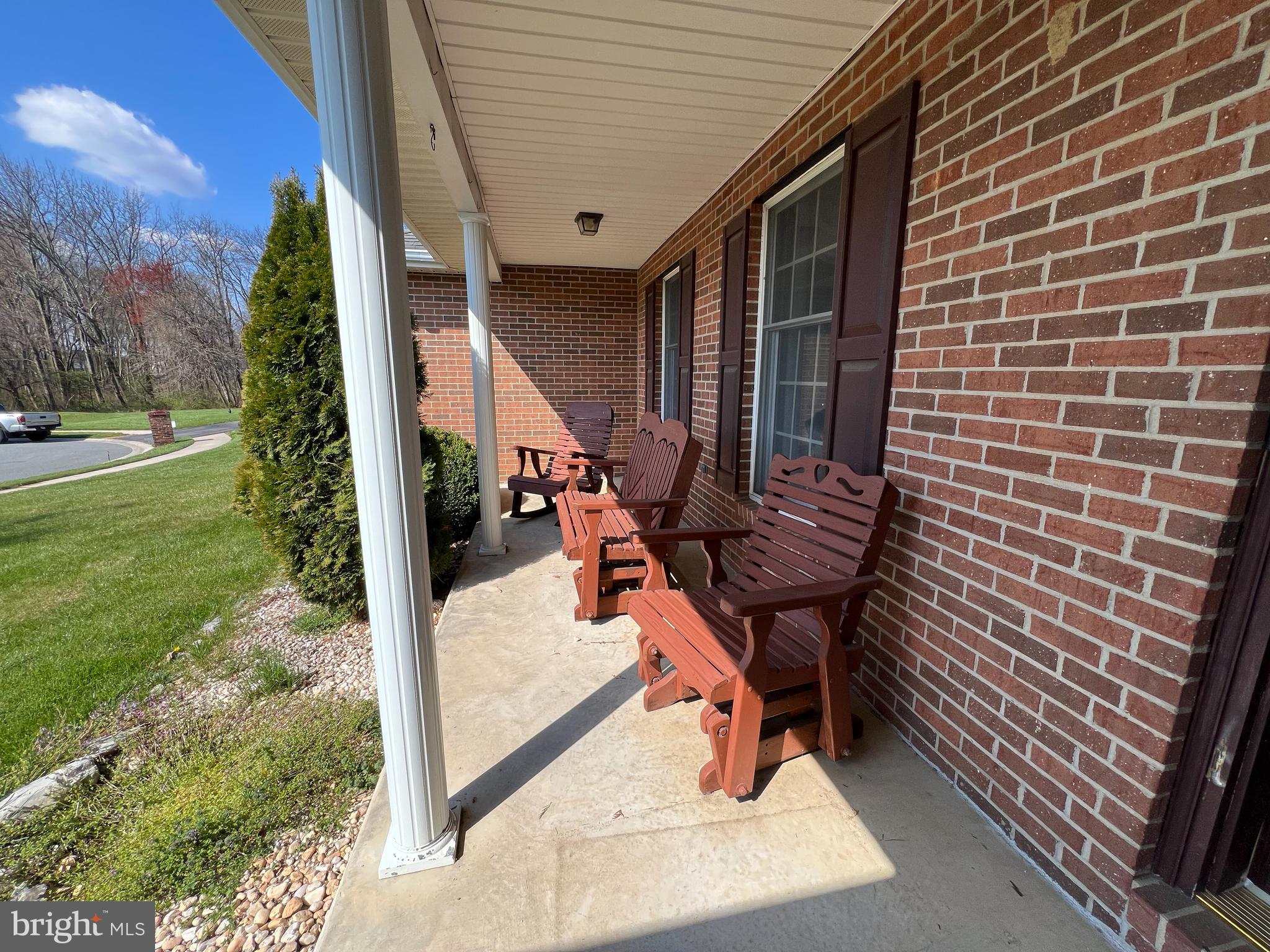 214 Mt Vernon Drive Bear, DE 19701 - Photo 2 of 44 a view of a porch with furniture and a yard