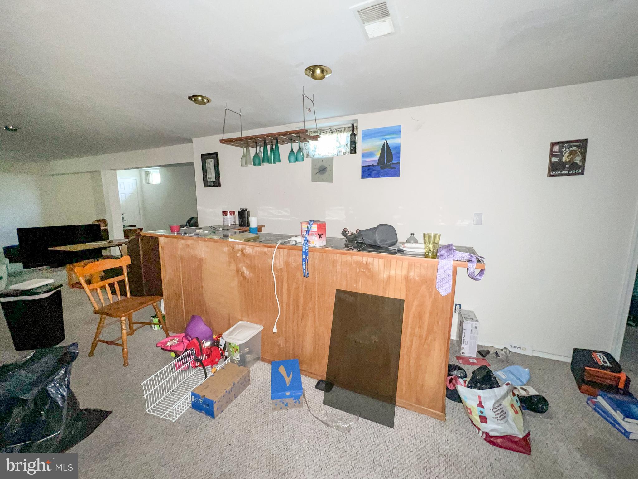 214 Mt Vernon Drive Bear, DE 19701 - Photo 27 of 44 a room with a refrigerator a couch and a couch