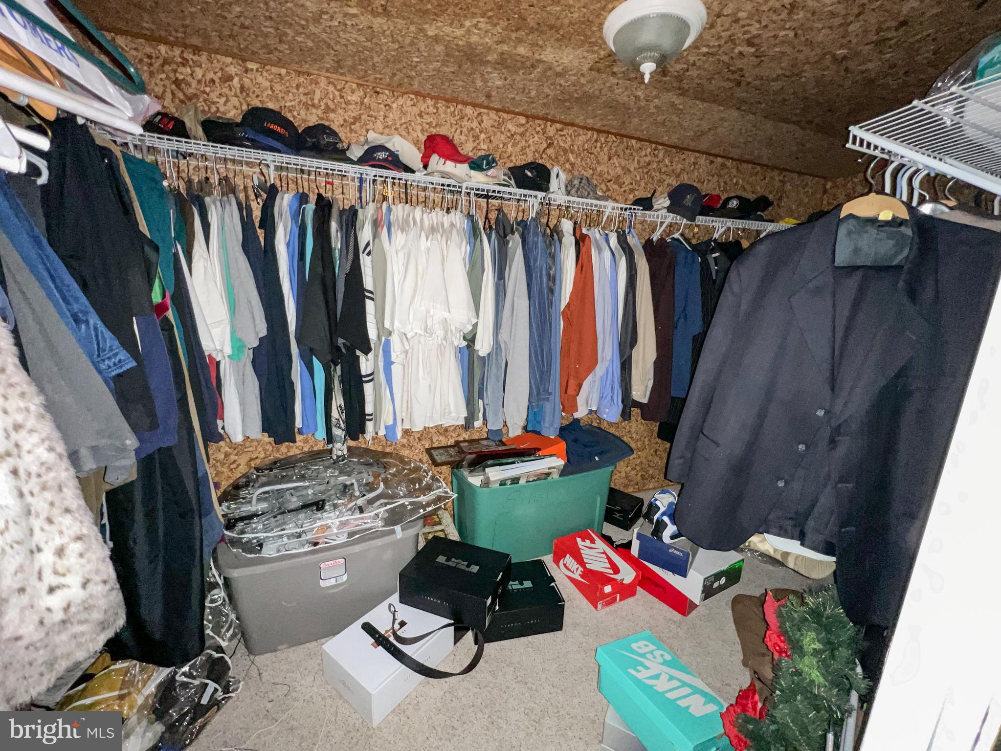 214 Mt Vernon Drive Bear, DE 19701 - Photo 35 of 44 a view of walk in closet with clothes and shoes