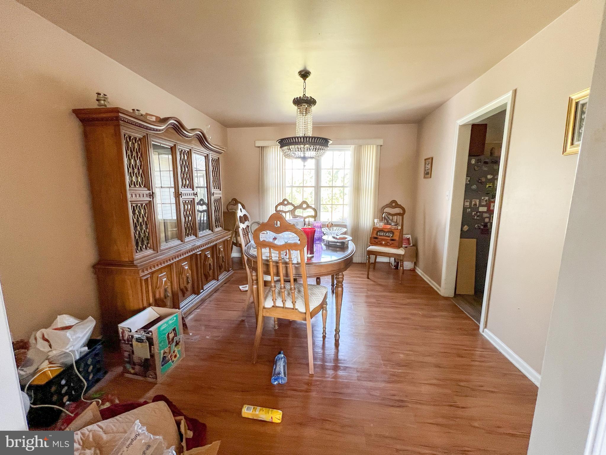 214 Mt Vernon Drive Bear, DE 19701 - Photo 7 of 44 a living room with furniture a wooden floor and a window