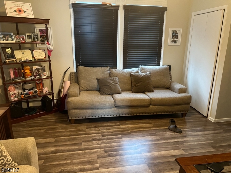 21 Chadwick Street Paterson, NJ 07503 - Photo 1 of 14 a living room with furniture and a rug