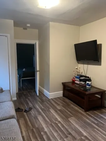 a living room with a flat screen tv and a fireplace