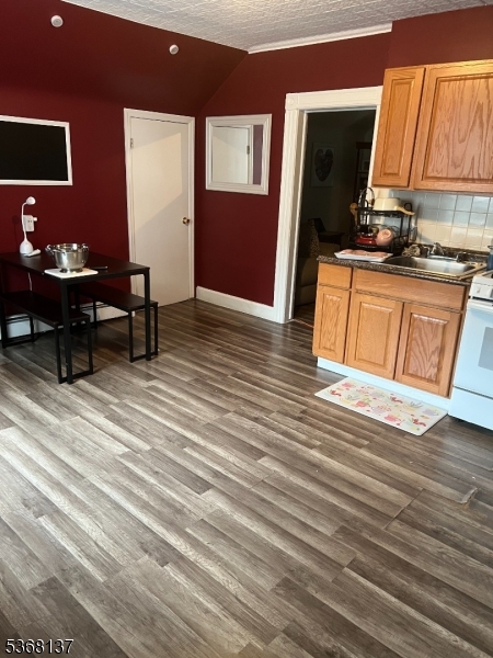 21 Chadwick Street Paterson, NJ 07503 - Photo 10 of 14 a living room with furniture wooden floor and a flat screen tv