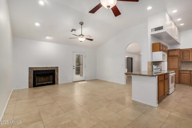 a view of a kitchen with a sink and a stove top oven