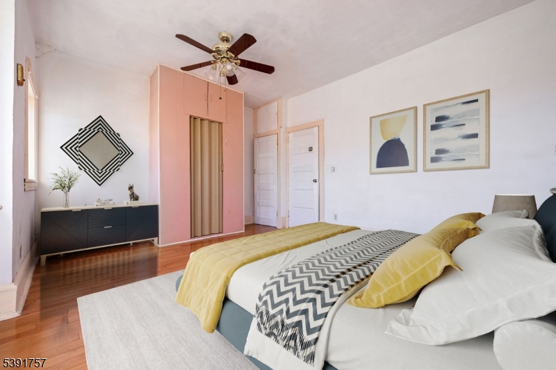 55 Thompson Street Raritan, NJ 08869 - Photo 16 of 23 a bedroom that has a bed and a painting on the wall