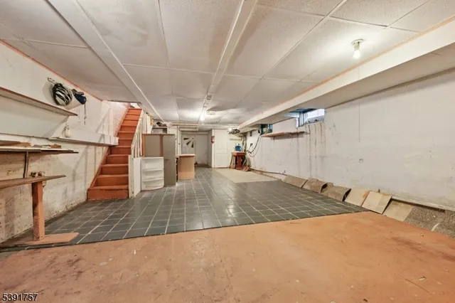 a view of a room with wooden floors