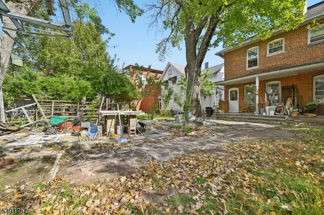 a view of a chair and tables in the patio