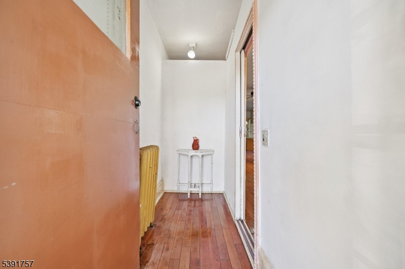 55 Thompson Street Raritan, NJ 08869 - Photo 3 of 23 a view of a hallway with wooden floor