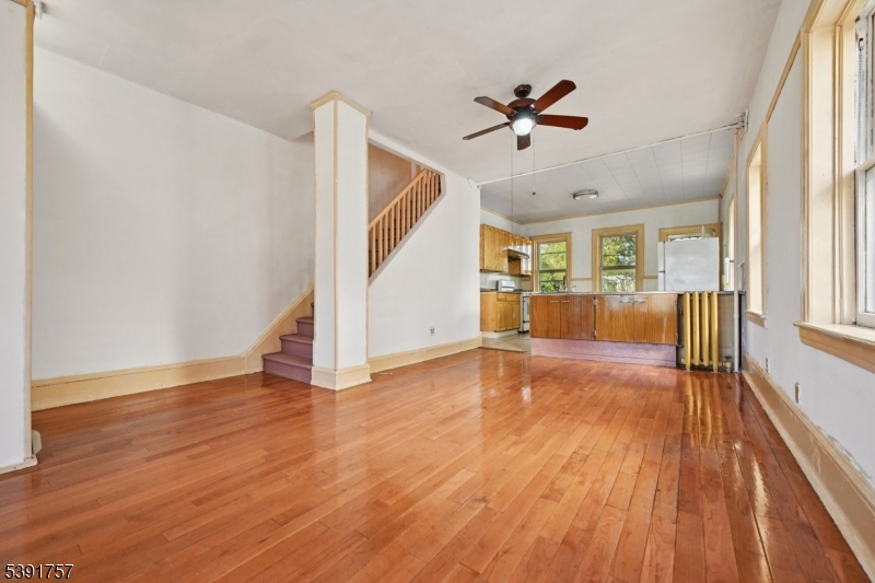 55 Thompson Street Raritan, NJ 08869 - Photo 4 of 23 wooden floor in an empty room with a window