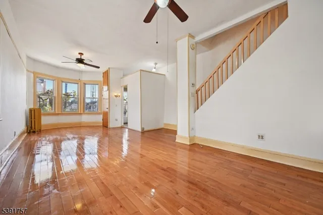 a view of an entryway with wooden floor