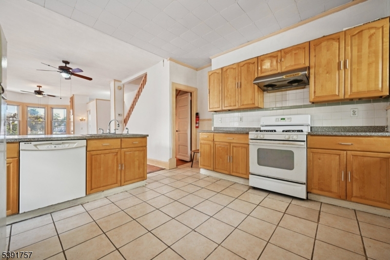55 Thompson Street Raritan, NJ 08869 - Photo 9 of 23 a kitchen with a stove sink and cabinets