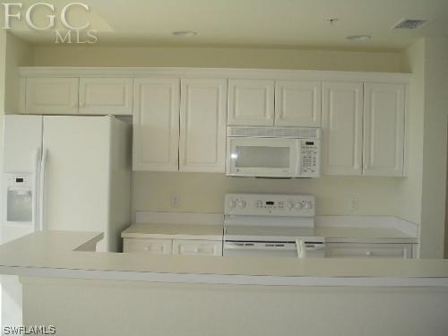 8570 Kingbird Loop, Unit 537 Estero, FL 33967 - Photo 4 of 8 a bathroom with a bathtub