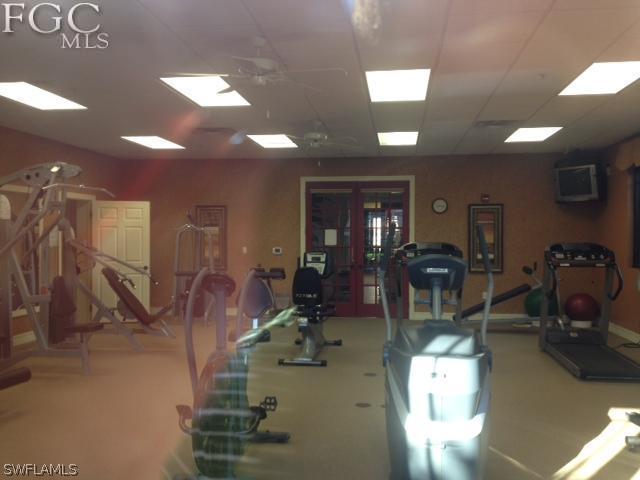 8570 Kingbird Loop, Unit 537 Estero, FL 33967 - Photo 8 of 8 a view of a room with gym equipment