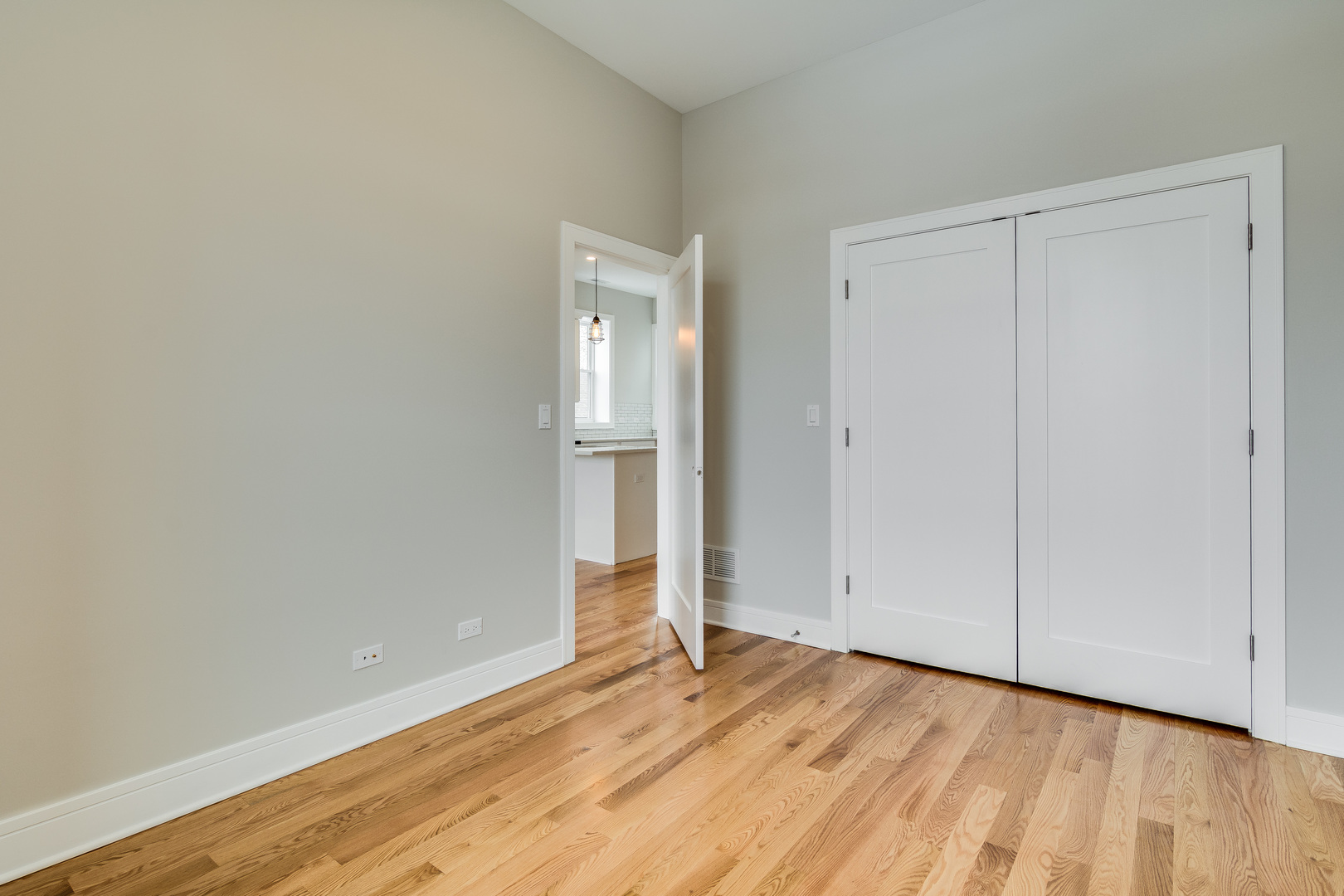 965 West 18th Street Chicago, IL 60608 - Photo 18 of 46 a view of an empty room and wooden floor