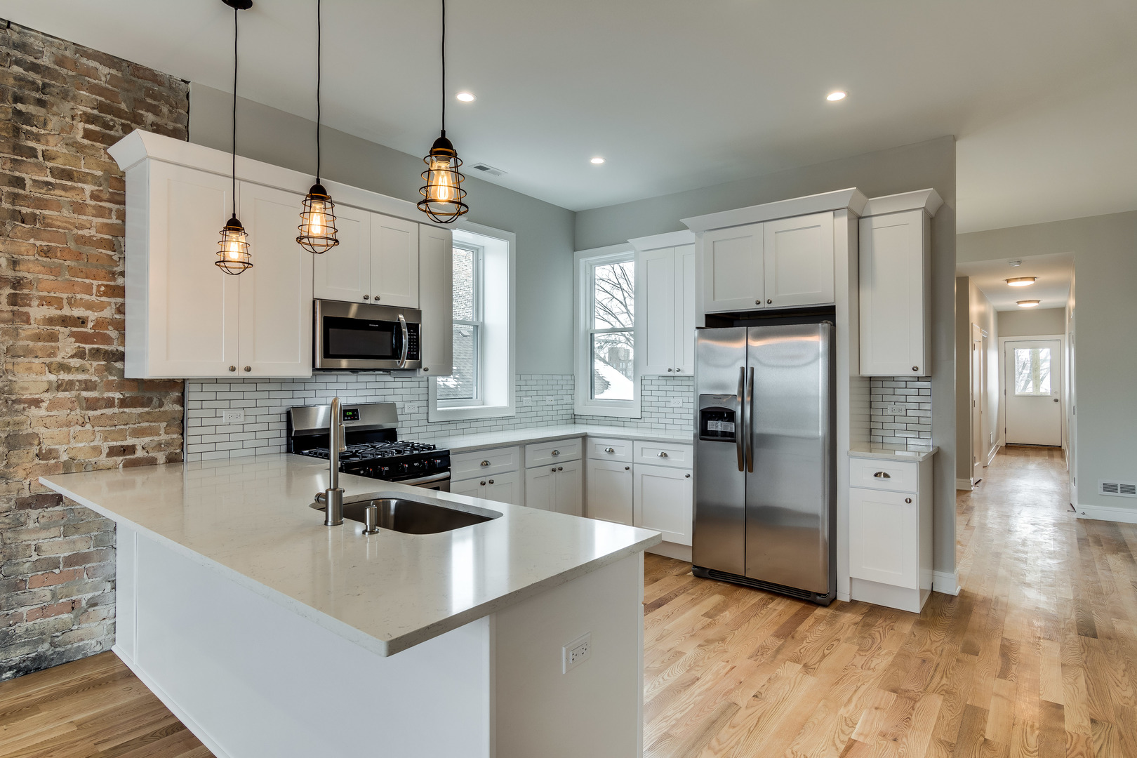 965 West 18th Street Chicago, IL 60608 - Photo 24 of 46 a kitchen with refrigerator and microwave