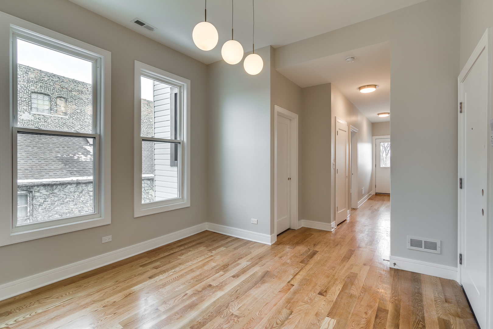 965 West 18th Street Chicago, IL 60608 - Photo 30 of 46 a view of livingroom with hardwood floor and window