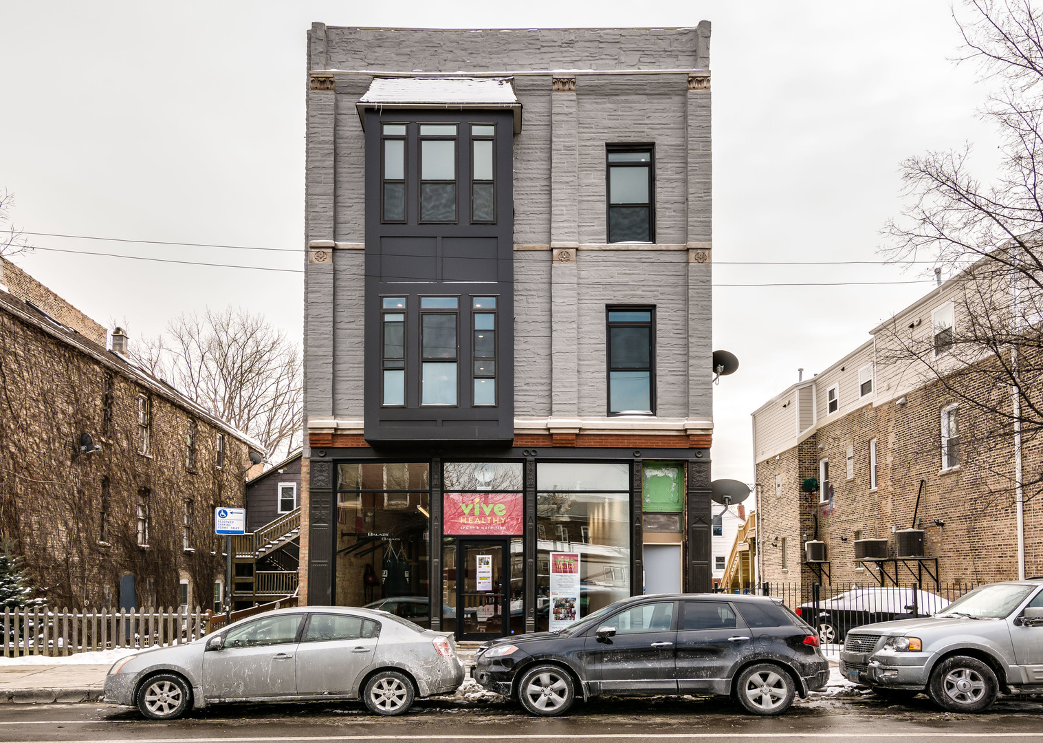 965 West 18th Street Chicago, IL 60608 - Photo 3 of 46 a view of a cars park in front of a building