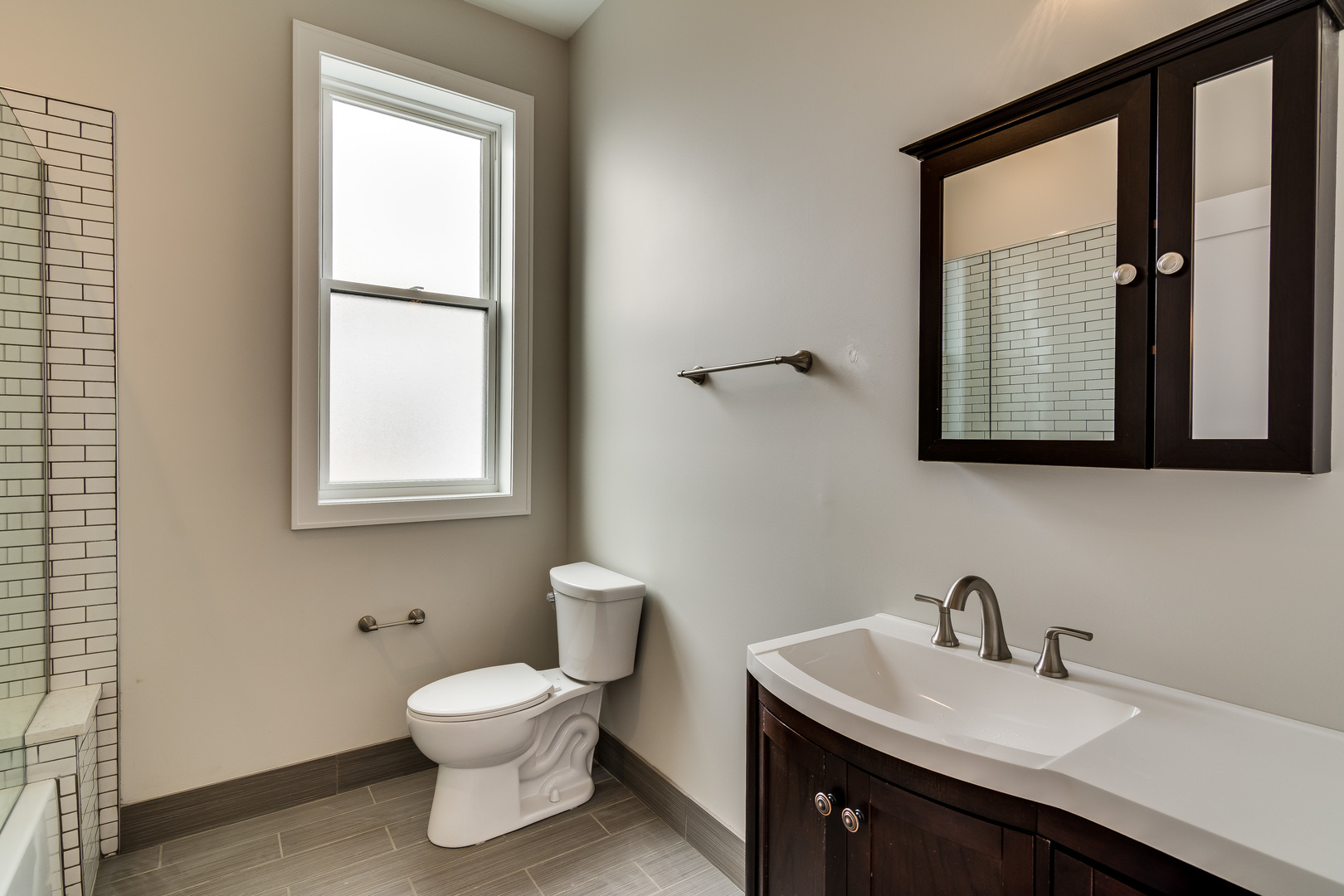 965 West 18th Street Chicago, IL 60608 - Photo 31 of 46 a bathroom with a toilet sink and mirror