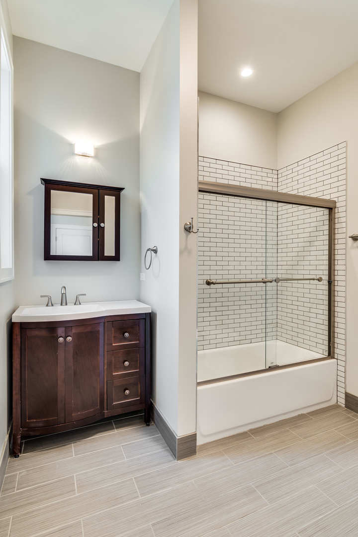 965 West 18th Street Chicago, IL 60608 - Photo 34 of 46 a spacious bathroom with a double vanity sink and mirror