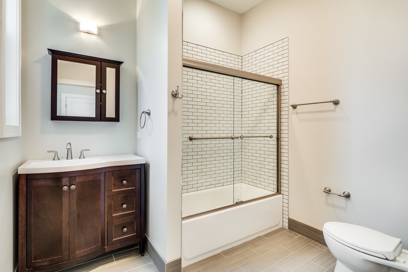 965 West 18th Street Chicago, IL 60608 - Photo 35 of 46 a bathroom with a granite countertop sink toilet and shower