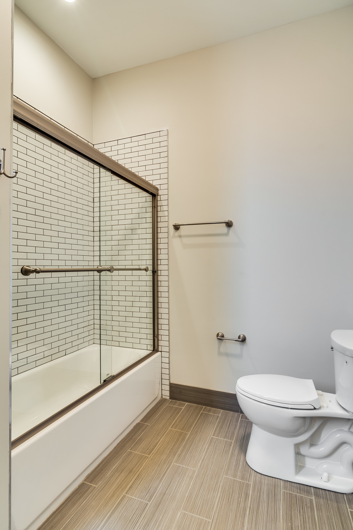 965 West 18th Street Chicago, IL 60608 - Photo 36 of 46 a bathroom with a toilet and a shower
