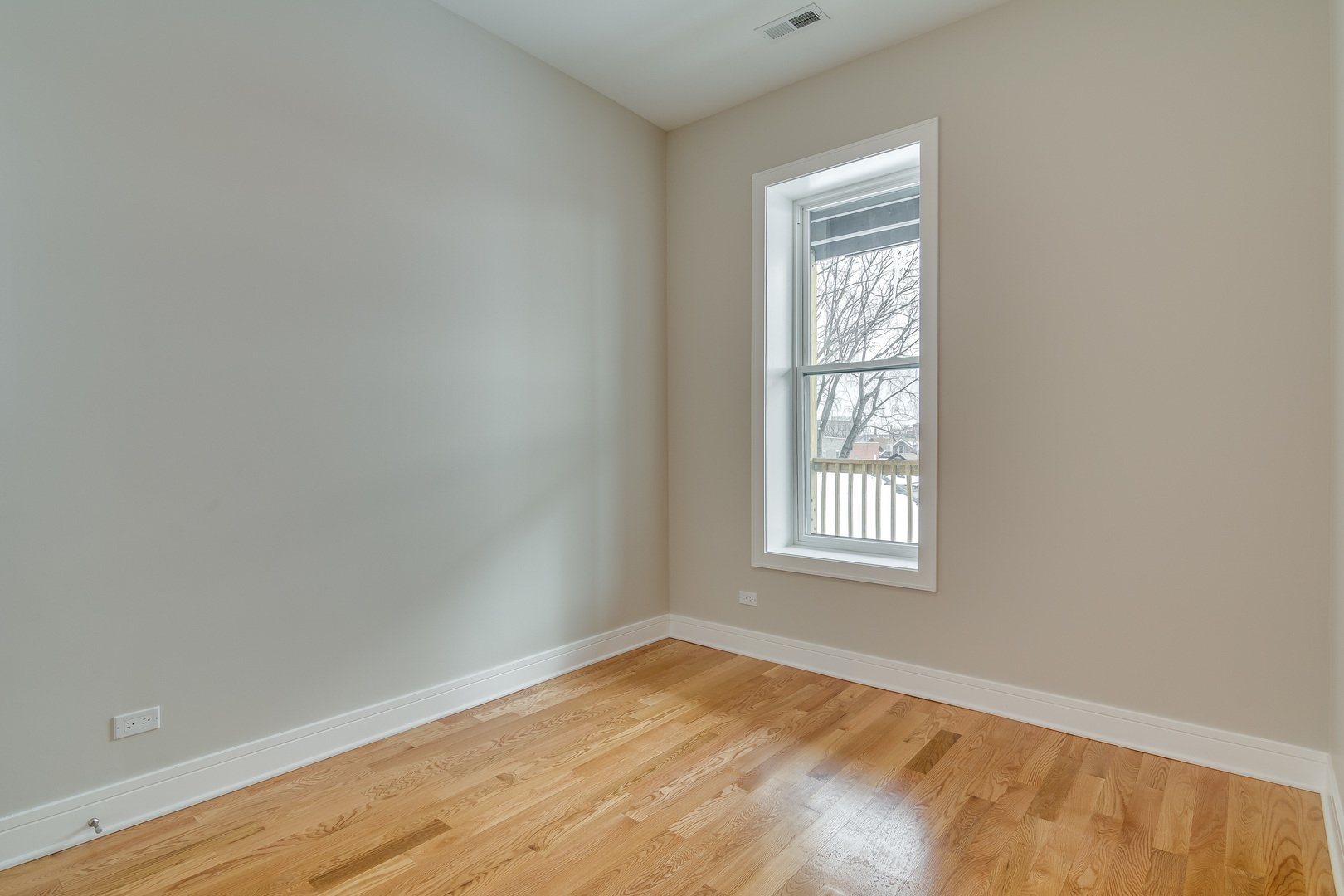965 West 18th Street Chicago, IL 60608 - Photo 37 of 46 a view of empty room with wooden floor and fan
